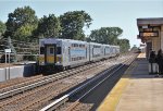 LI 5002 glides west with an OB train.